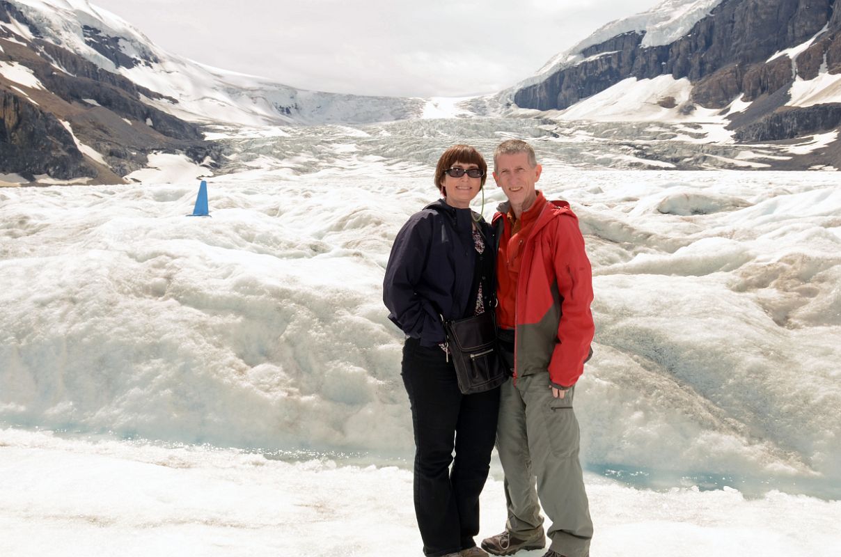 16 Charlotte Ryan and Jerome Ryan On Athabasca Glacier With Icefall Behind In Summer From Columbia Icefield